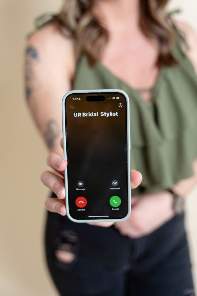 Hairstylist showing phone call from bridal stylist
