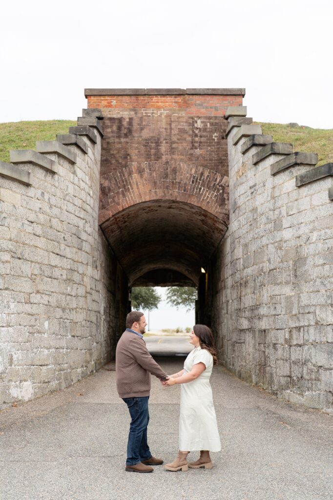 Couple holding hands and facing each other 
