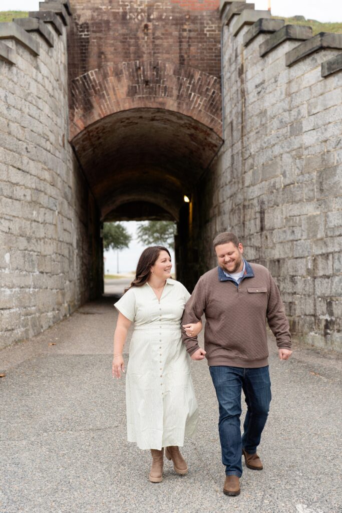 Couple smiling and posing for engagement photos