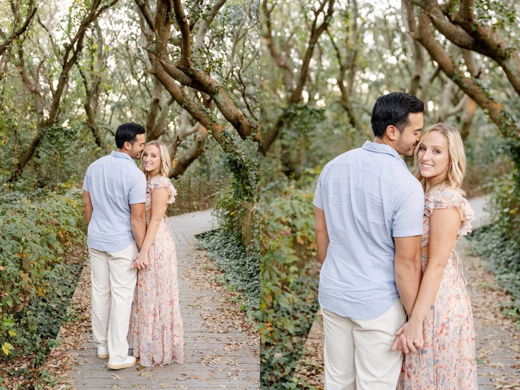 Couple portraits head kiss by the trees in Virginia Beach