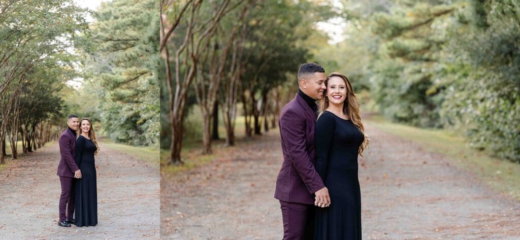 Couple walking along tree-lined path in formal black dress and purple suit