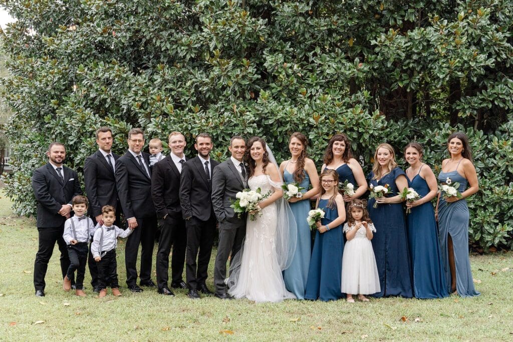September Virginia wedding party photo in front of foliage