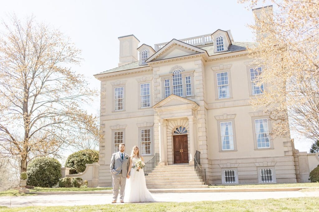 Bride and groom portraits in front of Great Marsh Estate