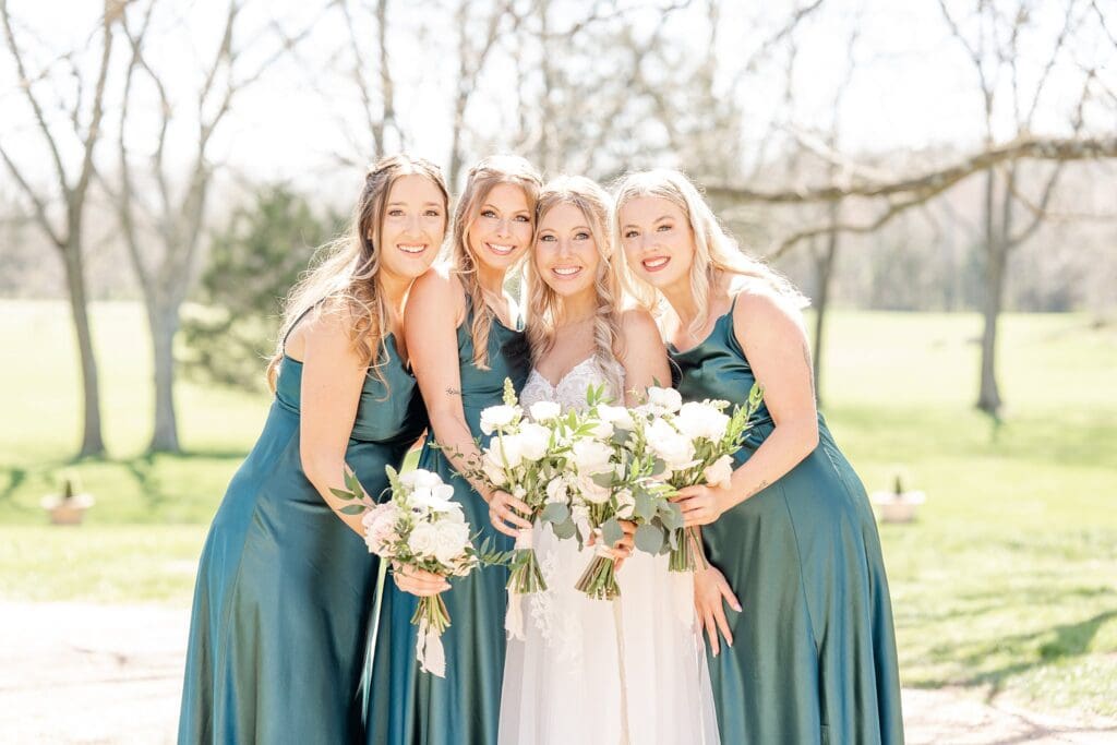 Bridge and bridesmaids in forest green flowers for before ceremony portraits