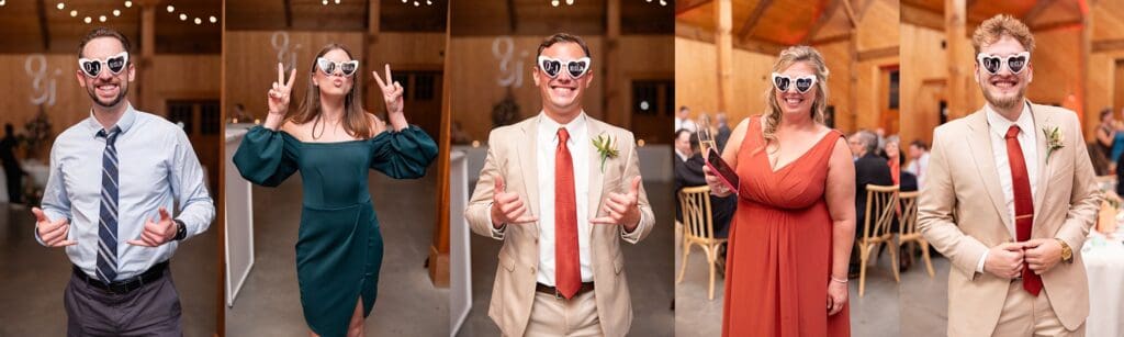 Wedding party posing in heart sunglasses