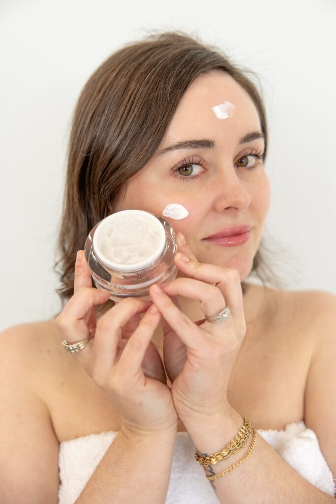 Person holding face cream