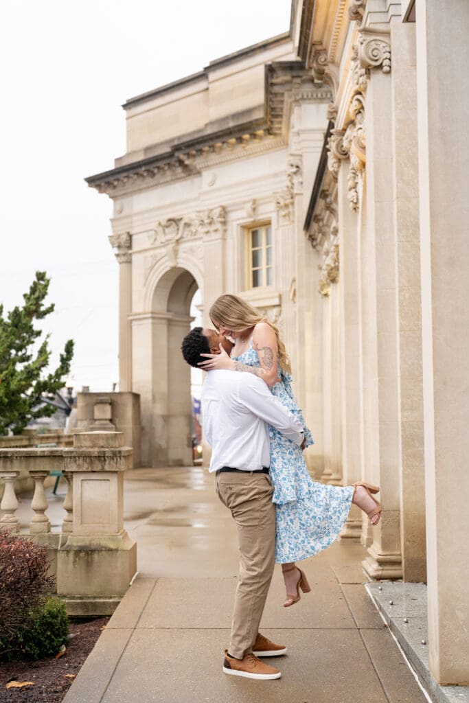 Engaged couple in front of the Handley Regional Library for their photos