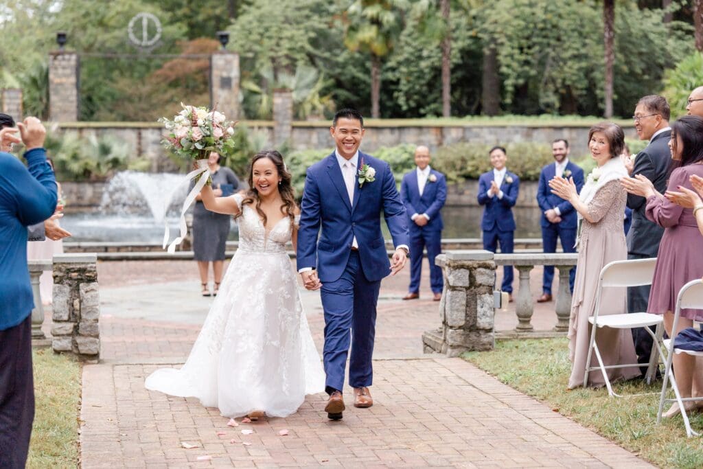 Bride and groom walking down aisle at Norfolk Botanical Garden wedding