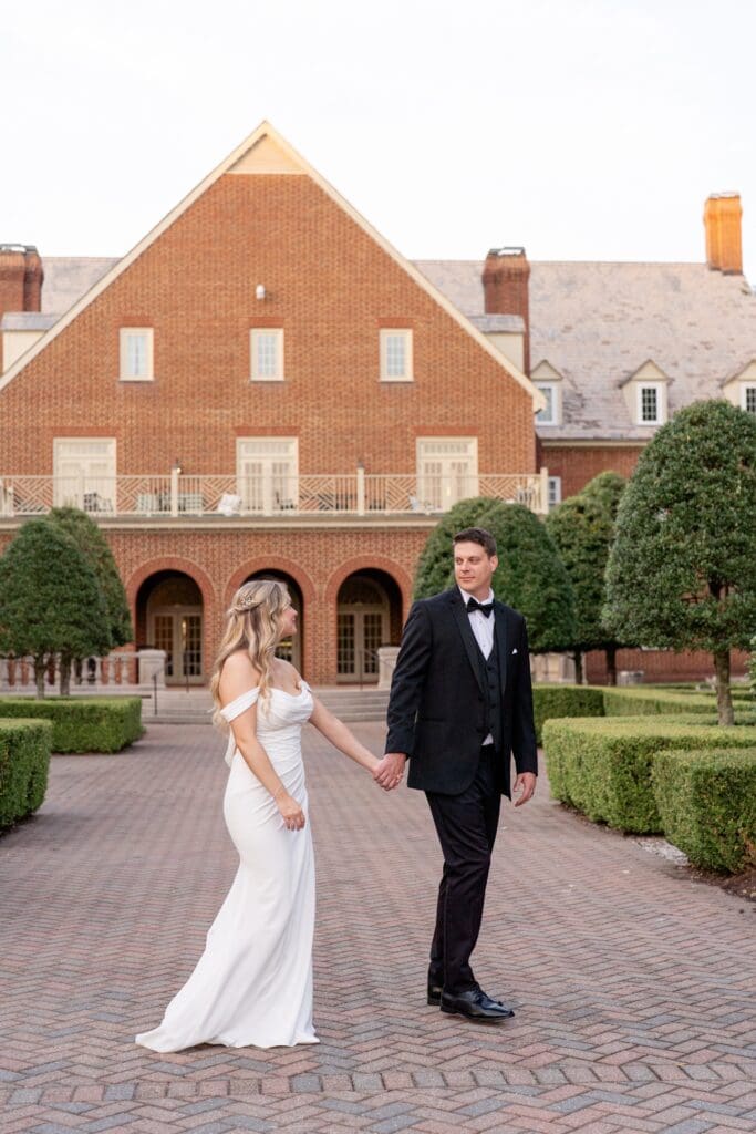 Bride and groom posing at The Founders Inn and Spa Virginia Beach wedding venue