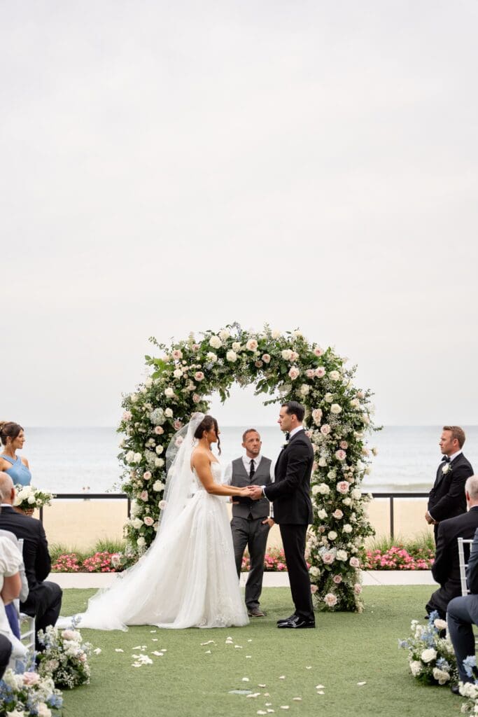 Couple exchanging vows at Marriott Virginia Beach Oceanfront Resort