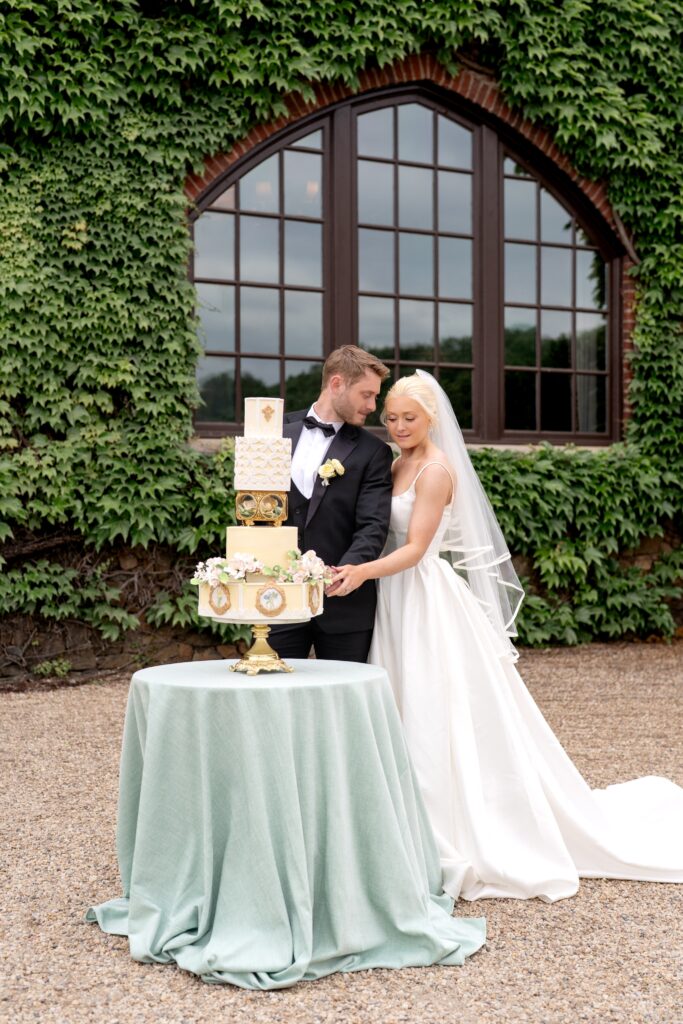 Bride and groom cutting cake at Dover Hall