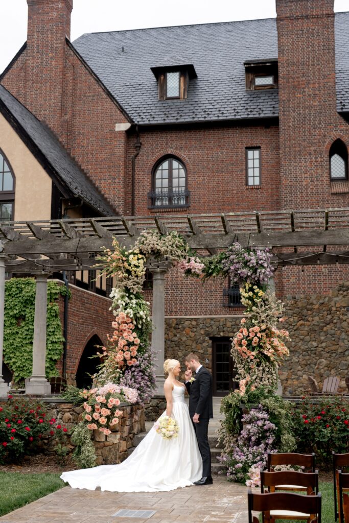 Bride and groom standing at altar for Dover Hall wedding