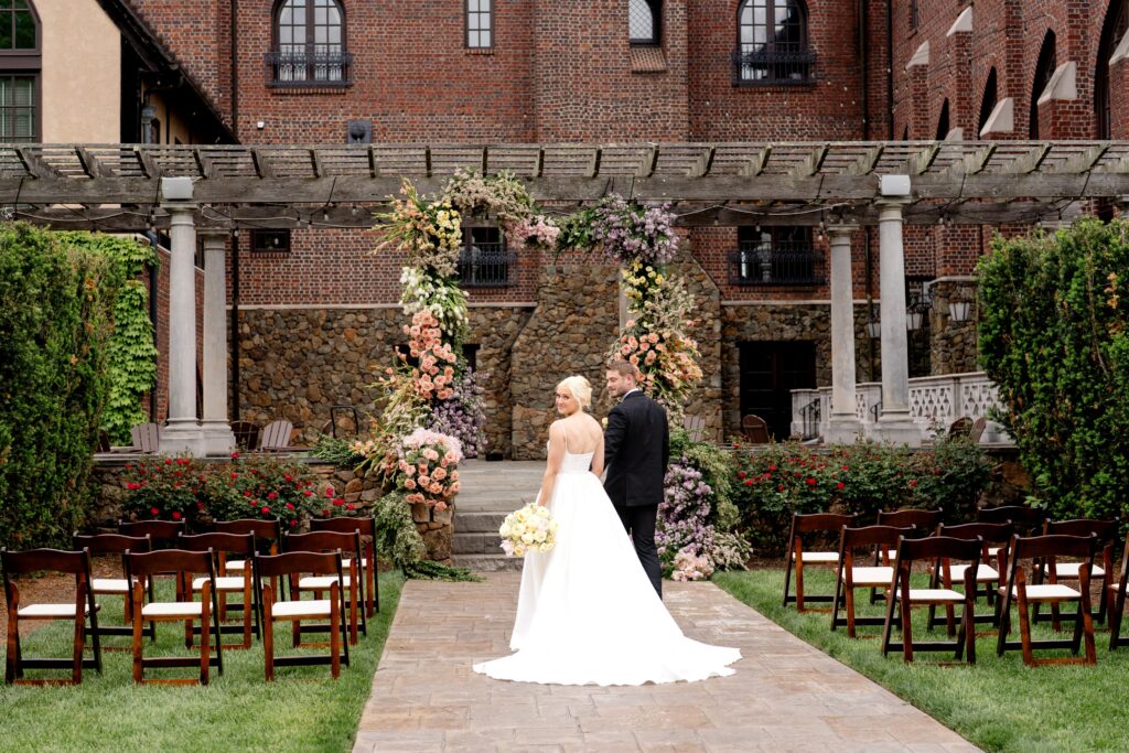Bride and groom looking back at camera