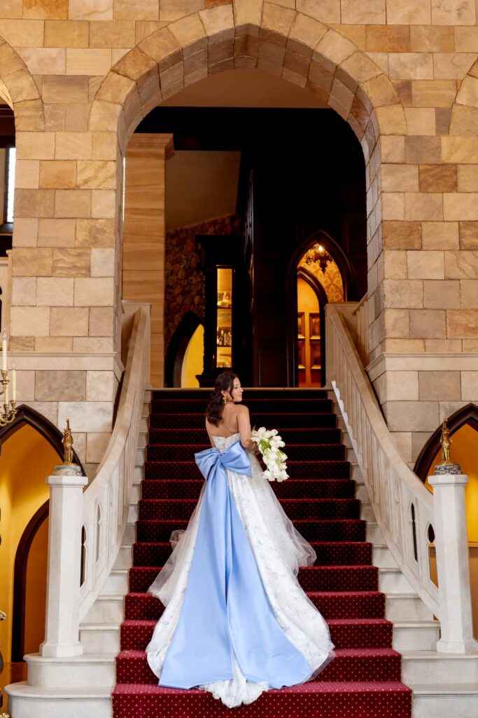 Bride on stairs at Dover Hall