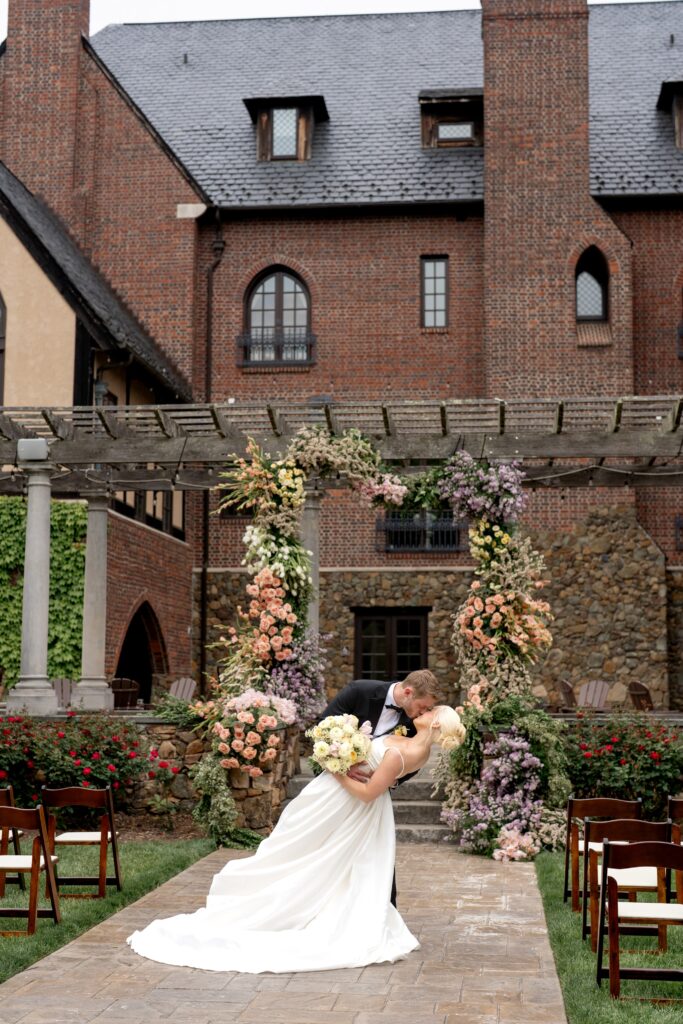 Bride and groom kissing at Dover Hall